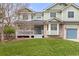 Inviting two-story home with well-manicured lawn and charming front porch at 7307 Pine Forest Ln, Parker, CO 80134