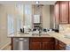 Open-concept kitchen showcasing island and seamless view of the living room at 7307 Pine Forest Ln, Parker, CO 80134