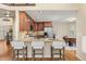 Modern kitchen with granite countertops, wood cabinets, and stainless steel appliances at 7307 Pine Forest Ln, Parker, CO 80134