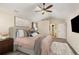 This main bedroom features neutral paint, a fluffy rug, and ensuite access at 7307 Pine Forest Ln, Parker, CO 80134