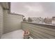 Balcony with a view of the surrounding neighborhood on a snowy day at 6742 S Winnipeg Cir # 105, Aurora, CO 80016