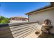 Outdoor balcony space features a decorative water feature and views of neighboring homes at 6742 S Winnipeg Cir # 105, Aurora, CO 80016