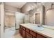 Bathroom featuring tile floors, a bathtub and shower combo with glass doors, and a single sink vanity at 6742 S Winnipeg Cir # 105, Aurora, CO 80016