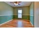 Cozy bedroom with hardwood floors and neutral paint, offering a comfortable and relaxing atmosphere at 6812 Blue Jay Dr, Parker, CO 80138