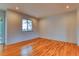 Bright bedroom with natural light, hardwood flooring, and neutral color palette at 6812 Blue Jay Dr, Parker, CO 80138