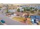 Aerial shot showcasing the home's exterior, front yard, driveway, and surrounding neighborhood at 6812 Blue Jay Dr, Parker, CO 80138