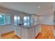 Kitchen featuring an island with granite countertops, modern cabinetry, and hardwood floors at 6812 Blue Jay Dr, Parker, CO 80138