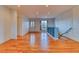 Bright living room features hardwood floors, recessed lighting, and a large window with custom shelving at 6812 Blue Jay Dr, Parker, CO 80138