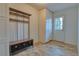 Functional mudroom with built-in storage cabinets and a coat rack, perfect for organization and convenience at 6812 Blue Jay Dr, Parker, CO 80138