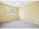 Neutral bedroom with carpet, a window, and ceiling fan to let you put your own touch on the space at 15597 E Dorado Ave, Centennial, CO 80015