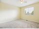 Spacious bedroom with neutral carpet, window with blinds, and a ceiling fan at 15597 E Dorado Ave, Centennial, CO 80015
