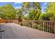 Large deck overlooking a well-maintained backyard with mature trees and landscaping at 15597 E Dorado Ave, Centennial, CO 80015