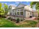 Back exterior of a home featuring a deck and nicely landscaped yard at 15597 E Dorado Ave, Centennial, CO 80015