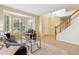 Light-filled living room with hardwood floors and large bay windows providing ample natural light at 15597 E Dorado Ave, Centennial, CO 80015