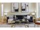 Tastefully decorated living room featuring a comfortable sofa, stylish art, and elegant decor at 15597 E Dorado Ave, Centennial, CO 80015