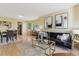 Bright living room with an open floor plan, adjacent to the dining area with natural light at 15597 E Dorado Ave, Centennial, CO 80015