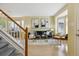Cozy living room with large windows, light hardwood floors, and stylish modern decor at 15597 E Dorado Ave, Centennial, CO 80015