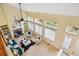 Bright living room with large windows, fireplace, high ceilings, and stylish decor at 15597 E Dorado Ave, Centennial, CO 80015