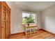 Charming entryway with hardwood floors, wood trim, and a quaint console table by the window at 1541 Poplar St, Denver, CO 80220