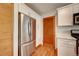 Beautiful kitchen featuring quartz countertops and stainless steel refrigerator at 1541 Poplar St, Denver, CO 80220