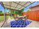 Outdoor patio with stylish table and chairs set for relaxation and outdoor dining at 1541 Poplar St, Denver, CO 80220