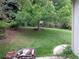 Expansive backyard with lush green lawn and mature tree, perfect for outdoor activities and relaxation at 13651 Silverton Dr, Broomfield, CO 80020