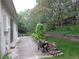 Inviting backyard featuring a lush garden, mature trees, and a stone patio for relaxing outdoors at 13651 Silverton Dr, Broomfield, CO 80020