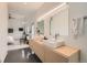 Main bathroom with double vanity and modern fixtures, open to main bedroom at 3850 Vallejo St, Denver, CO 80211