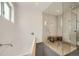 Modern bathroom featuring a luxurious tub and glass-enclosed shower at 3850 Vallejo St, Denver, CO 80211