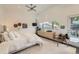 Bright bedroom featuring a ceiling fan, large window, and modern decor at 3850 Vallejo St, Denver, CO 80211