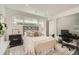 Bright bedroom featuring a large window, stylish rug, and a comfortable bed with neutral-toned bedding at 3850 Vallejo St, Denver, CO 80211