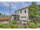 Contemporary home with modern architecture, balcony, landscaped yard and a metal fence at 3850 Vallejo St, Denver, CO 80211
