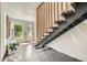 Bright foyer with contemporary staircase and welcoming entryway at 3850 Vallejo St, Denver, CO 80211