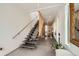 Modern foyer featuring a unique staircase and stylish decor at 3850 Vallejo St, Denver, CO 80211