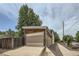 Garage exterior featuring wooden design and a concrete driveway at 3850 Vallejo St, Denver, CO 80211