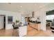 Modern kitchen featuring stainless steel appliances, a breakfast bar, and ample counter space at 3850 Vallejo St, Denver, CO 80211