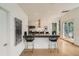 Modern kitchen featuring stainless steel appliances, a breakfast bar, and ample counter space at 3850 Vallejo St, Denver, CO 80211