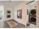Functional laundry area featuring a stacked washer and dryer at 3850 Vallejo St, Denver, CO 80211