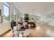 Spacious living room with wood floors, stone fireplace, modern furniture, and plenty of natural light at 3850 Vallejo St, Denver, CO 80211