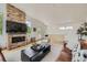 Inviting living room with a brick fireplace and entertainment center at 3850 Vallejo St, Denver, CO 80211