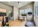 Inviting home office with natural light, hardwood floors, and exercise equipment at 3850 Vallejo St, Denver, CO 80211