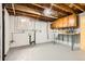 An unfinished basement area with laundry hookups and a small window at 1860 W Crestline Dr, Littleton, CO 80120