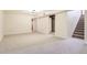 An empty basement room with neutral-colored carpet and one window at 1860 W Crestline Dr, Littleton, CO 80120