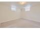 A bare basement area with carpeting and minimal windows at 1860 W Crestline Dr, Littleton, CO 80120