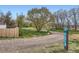 LITTLETON COMMUNITY TRAIL sign, with trail and trees in the background at 1860 W Crestline Dr, Littleton, CO 80120