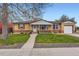 Charming brick ranch-style home with a well-manicured front yard and an attached one-car garage at 1860 W Crestline Dr, Littleton, CO 80120