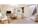 Relaxing living room with neutral tones and comfortable seating arrangement at 1860 W Crestline Dr, Littleton, CO 80120