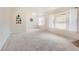 Spacious, carpeted living room with large windows offering plenty of natural light at 1860 W Crestline Dr, Littleton, CO 80120