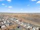 Aerial view of a residential neighborhood, showing the layout, homes, and surrounding landscape at 2489 Alto St, Fort Lupton, CO 80621