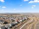 Aerial view of a community that showcases a home with a pin drop in a well-planned neighborhood at 2489 Alto St, Fort Lupton, CO 80621